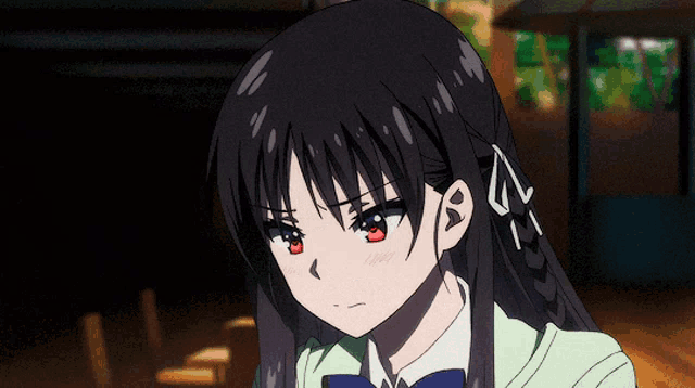 a girl with long black hair and a bow in her hair