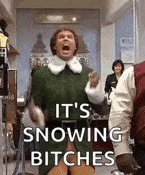 a man in a green elf costume is standing in a room with his mouth open and screaming .