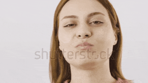 a close up of a woman 's face with the words shutterstock visible in the corner