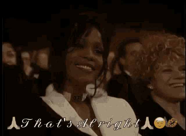 a woman sitting in a crowd with the words that 's alright