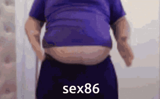 a man in a purple shirt has a very large belly and the word sex86 is on the bottom of the image
