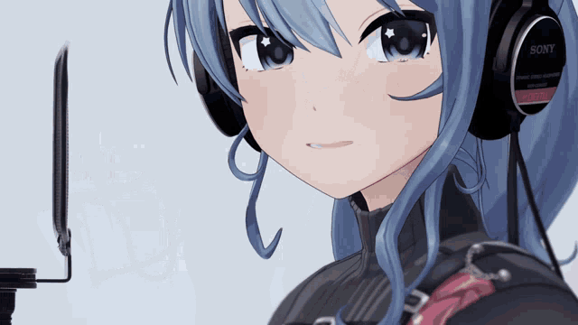 a close up of a girl wearing headphones that say sony on them