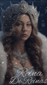 a woman wearing a crown and a necklace with the name reina written on it