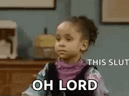 a little girl is sitting at a table with the words `` oh lord '' written on it .