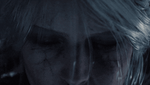a close up of a person 's face with a tear coming out of their eye