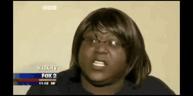 a woman with glasses is on a fox 2 news channel