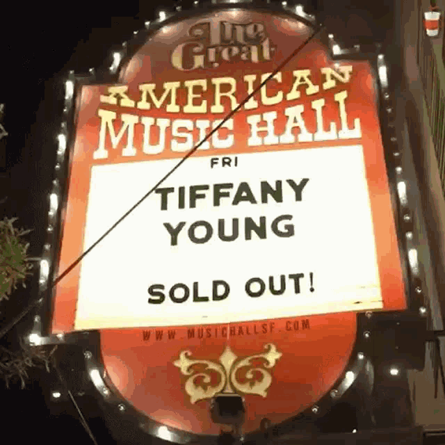 a sign that says tiffany young sold out