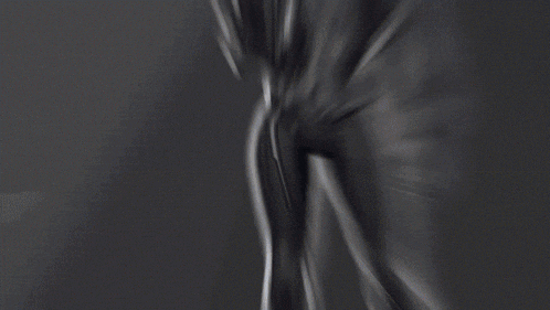 a blurred image of a woman in a superhero costume with the word love in the background