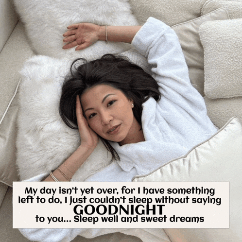 a woman laying on a bed with a goodnight message on the bottom