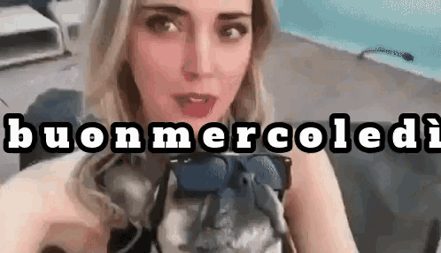 a woman is taking a selfie with a dog and the words buon mercoledi are visible