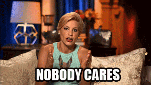 a woman sitting on a couch with the words " nobody cares " on her face