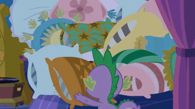 spike from my little pony laying on a bed with many pillows
