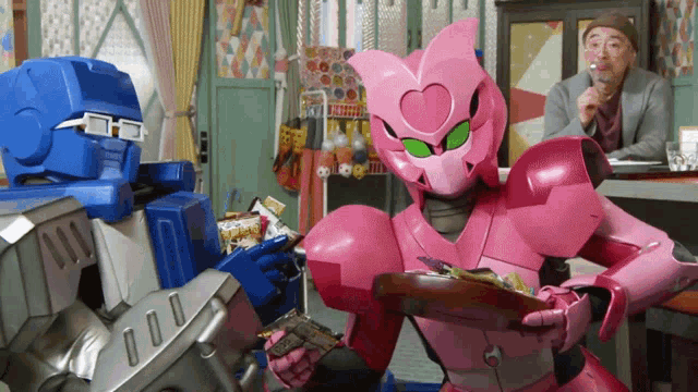 a pink robot with a heart on her head holds a tray of food