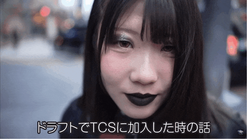 a close up of a woman 's face with the words " tcs " on the bottom right