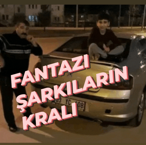 a man standing next to a car that says fantazi