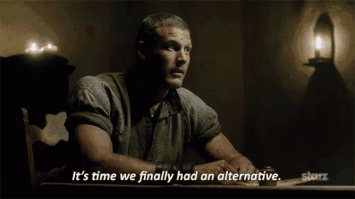 a man is sitting at a table with the words it 's time we finally had an alternative