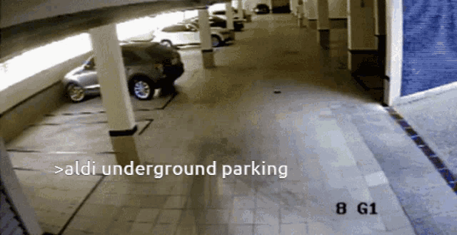 a car is parked in an aldi underground parking area