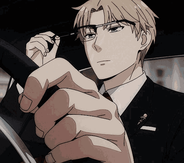 a man in a suit and tie is holding a pair of glasses