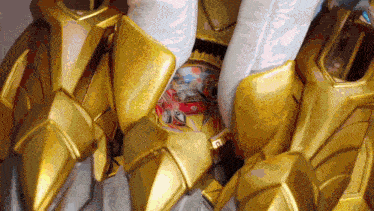 a close up of a gold armor with a sticker that says ' knight '