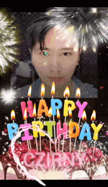 a picture of a man with a birthday cake and candles that say happy birthday