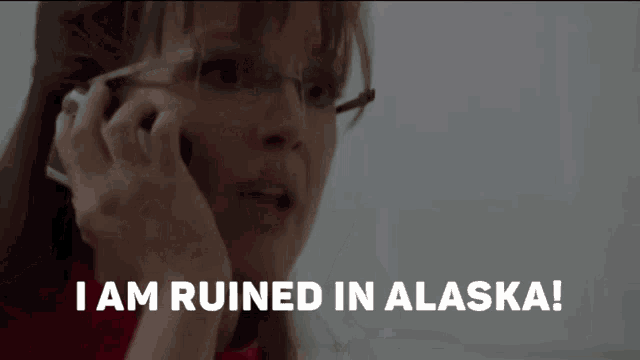 a woman talking on a cell phone with the words i am ruined in alaska