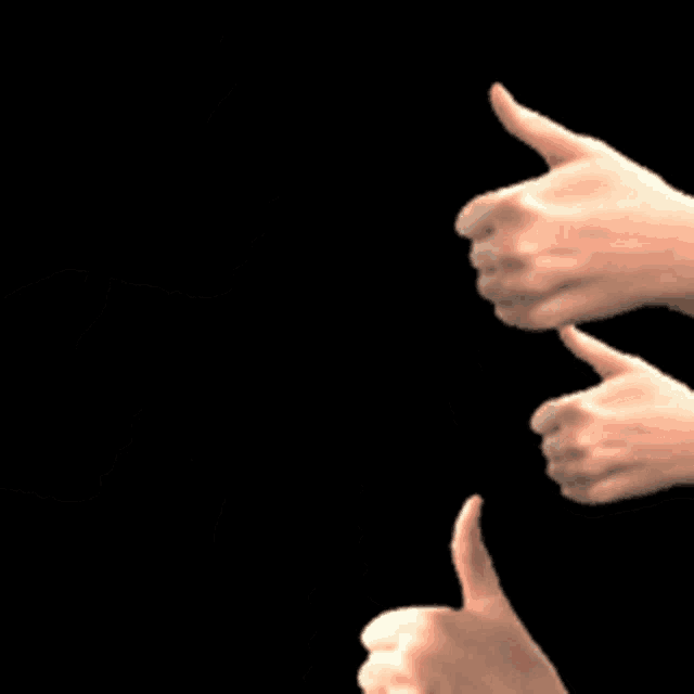 several hands are giving a thumbs up sign