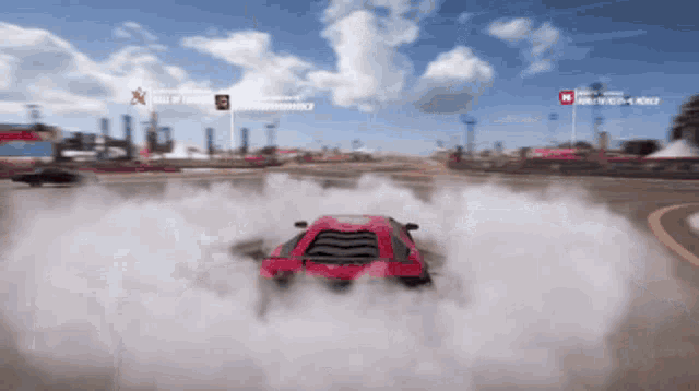 a red car is drifting in a video game with a sign that says hall of fame on it