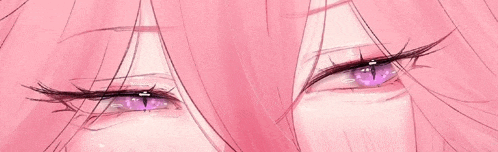 a close up of a girl 's eyes with pink hair .