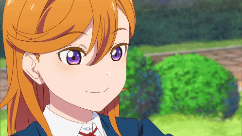a close up of a girl with purple eyes and orange hair