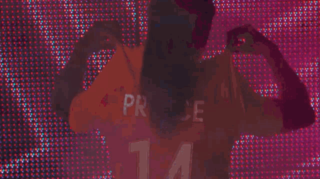 a person wearing a jersey that says 14 on it