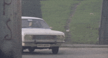 a white car with 4875 ar 92 on the front license plate