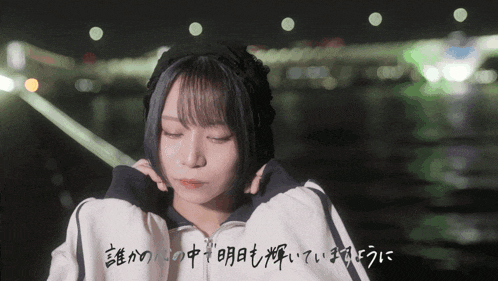 a girl with chinese writing on her shirt