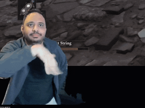 a man stands in front of a screen that says ' t string '