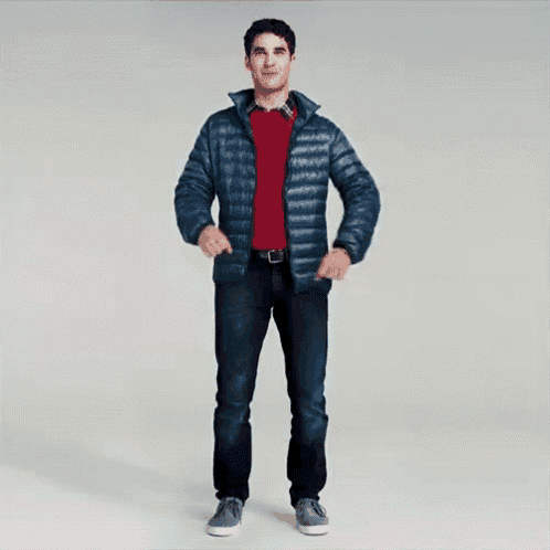 a man wearing a blue jacket and a red sweater is dancing