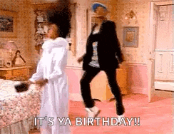 a man and a woman are dancing in a bedroom with the words `` it 's ya birthday '' .