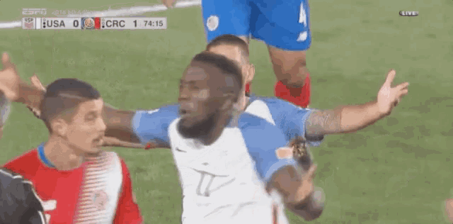 a soccer player with the number 8 on his jersey is hugging another player