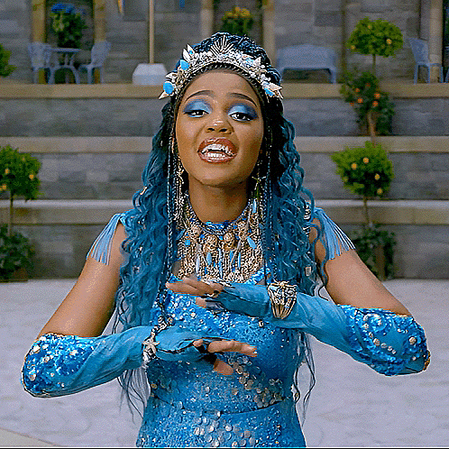 a woman with blue hair and blue gloves is wearing a crown