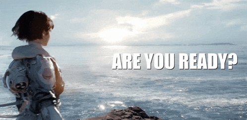 a person standing on a rock in front of the ocean with the words are you ready