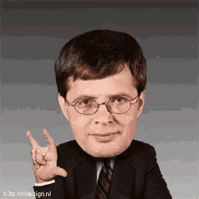 a man in a suit and tie is making a horns sign