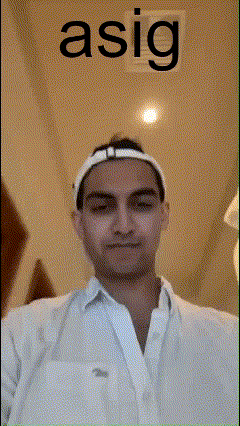 a man wearing a white shirt and a white headband with the word asig written above him