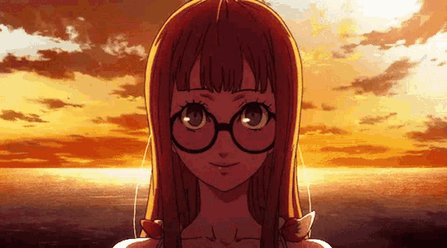 a girl with long red hair and glasses is smiling in front of a sunset over the ocean .