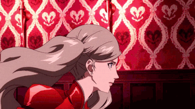 a woman in a red dress is running in front of a heart shaped wallpaper