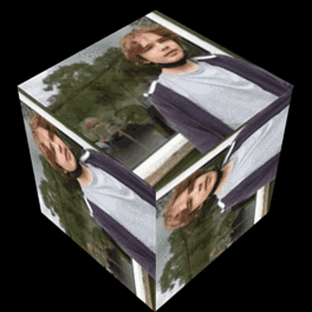 a cube with a picture of a young man in it