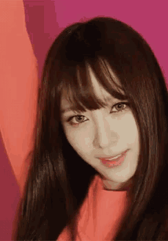 a close up of a woman 's face with long hair