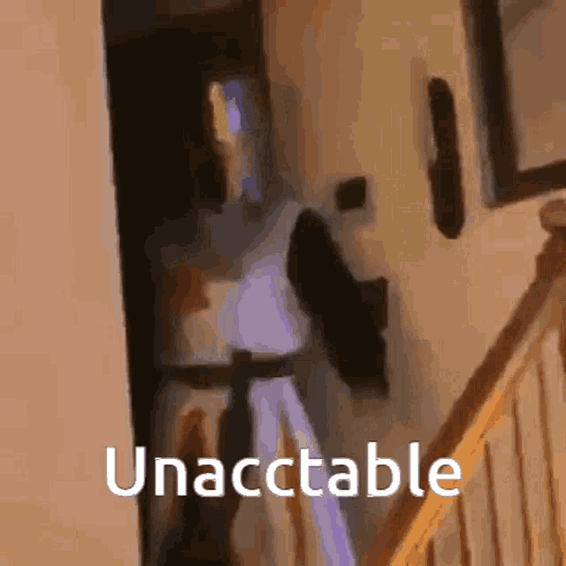 a person is walking down a set of stairs with the words unacctable written on the bottom of the image .