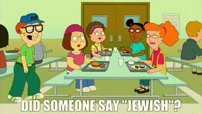 a group of people are sitting at tables in a cafeteria with the words " did someone say jewish " in the corner