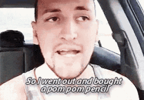 a man is sitting in the back seat of a car and saying so i went out and bought a pompom pencil .