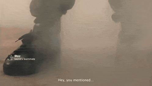 a person 's feet are covered in smoke and the words hey you mentioned are on the screen