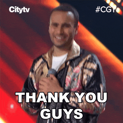 a man holding a microphone with the words thank you guys below him