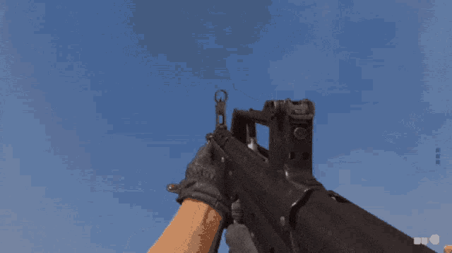 a gun with a blue sky behind it
